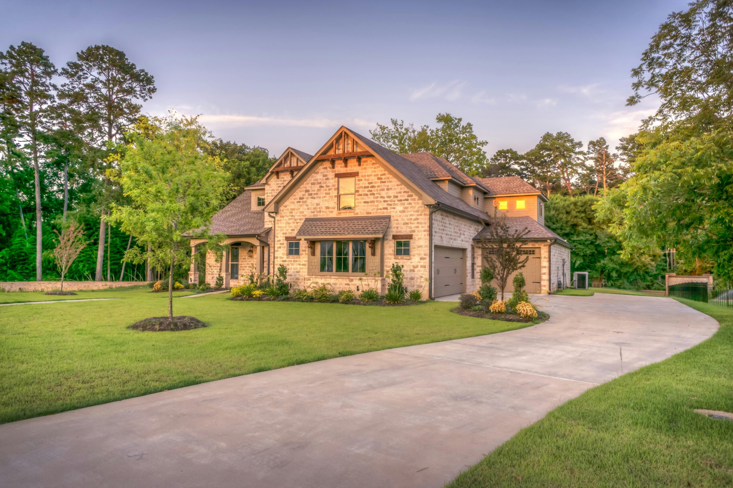 new home at sunset with new garage doors
