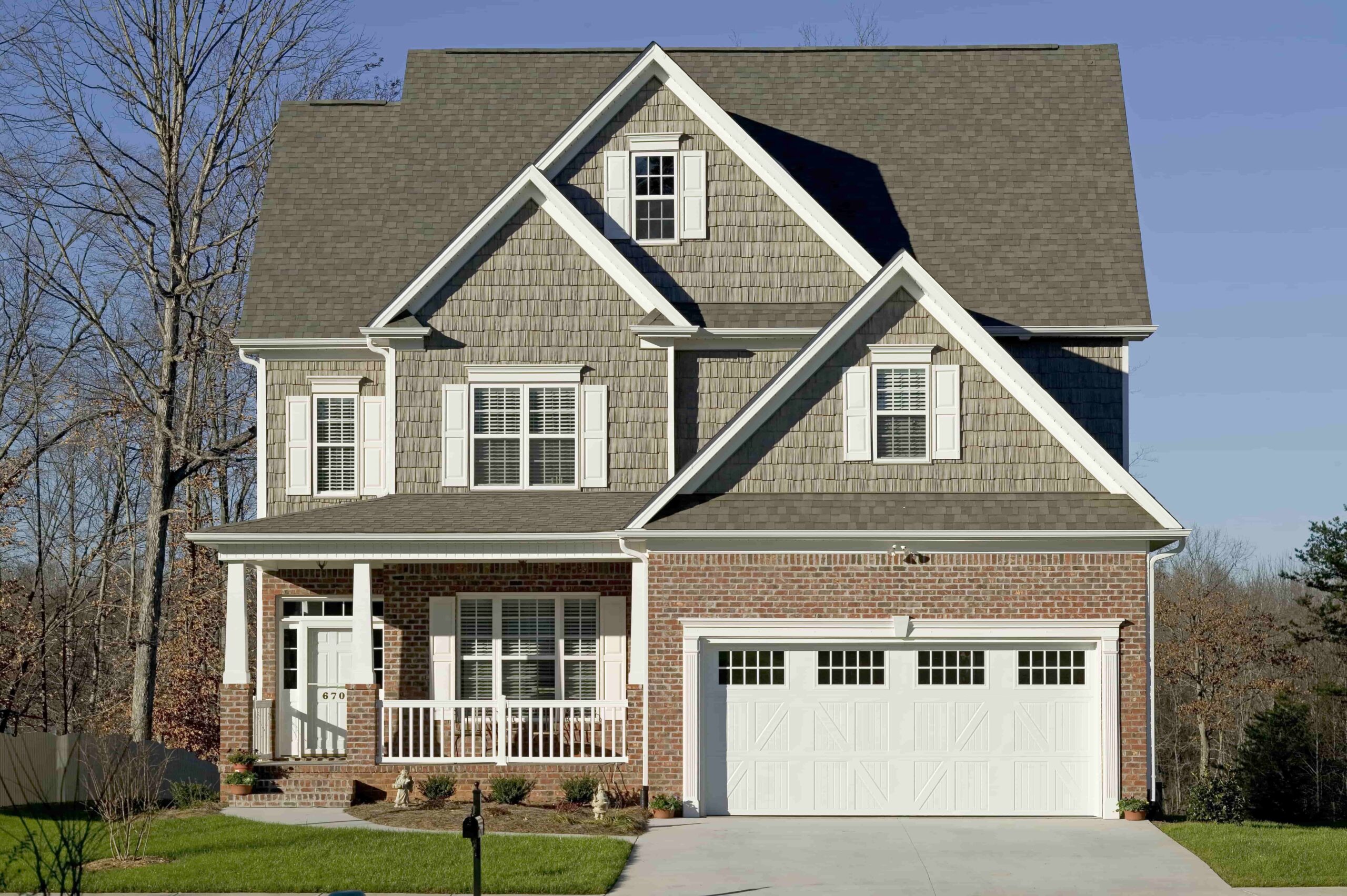 Home with brand new white garage door